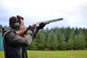 A man performing clay shooting